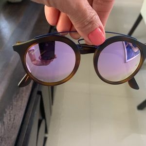 Ray Ban round sunglasses with pink mirror glasses.
